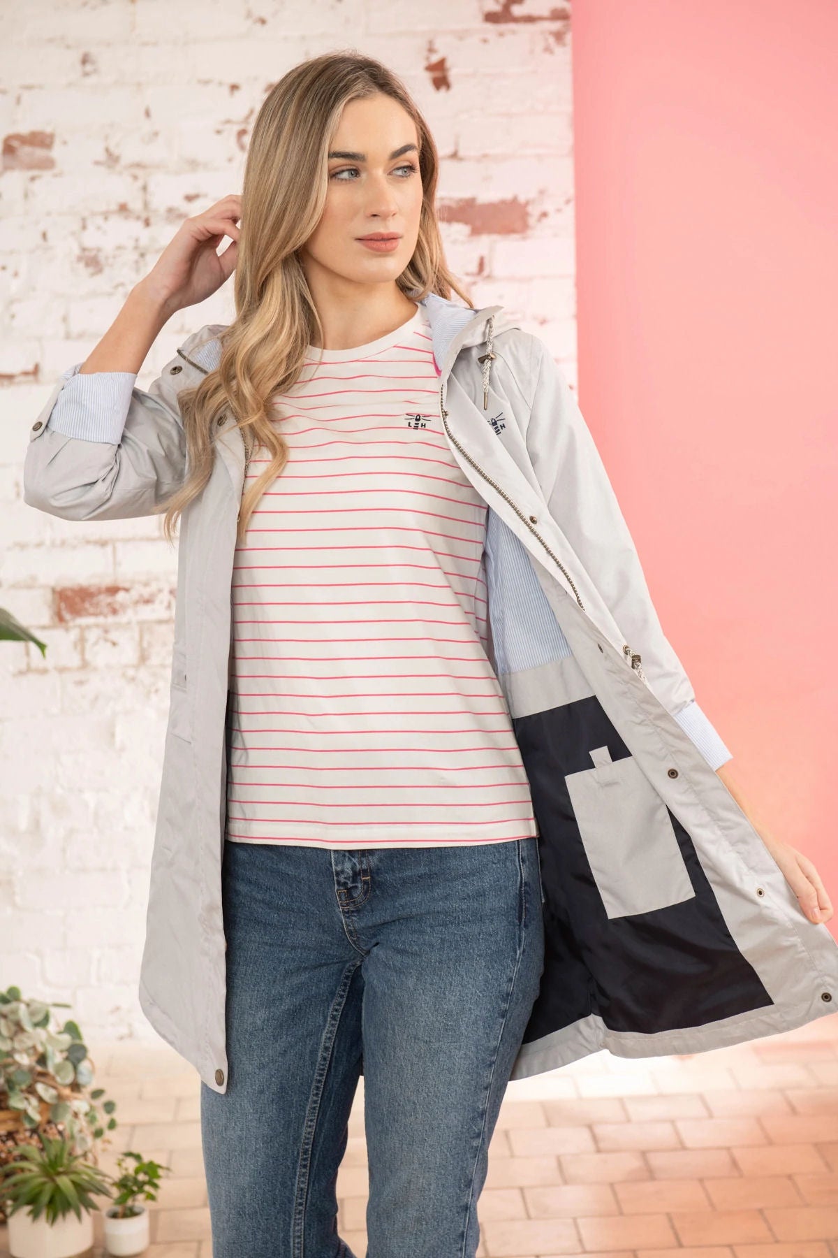 Sand coloured waterproof women's Alice rain jacket from Lighthouse with fine stripe pattern lining.