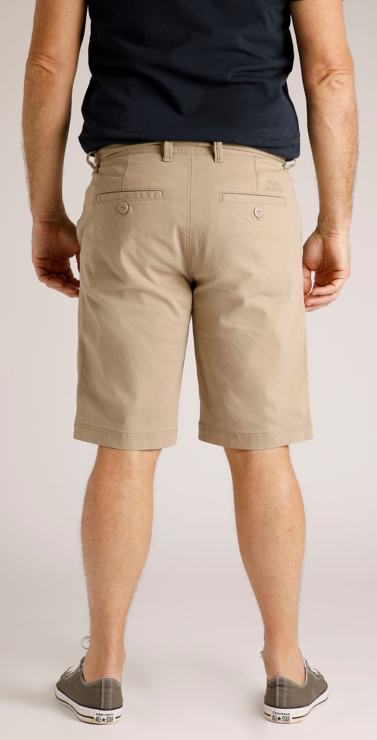 Back view of man wearing Weird Fish mens Rayburn chino shorts Taupe Grey with buttoned rear pockets