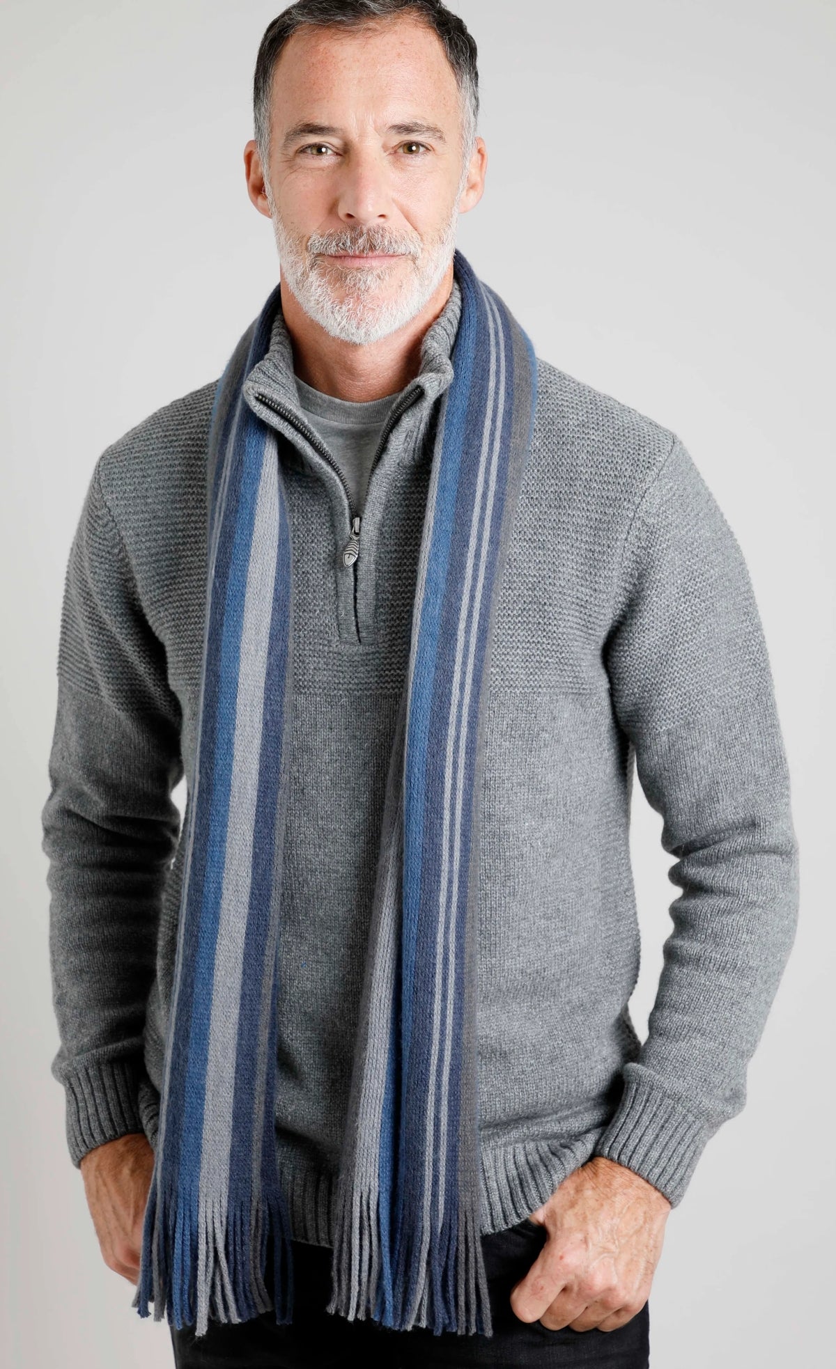 Weird Fish Hartford scarf in Ensign Blue with a blue and grey vertical stripe pattern and tassel ends.