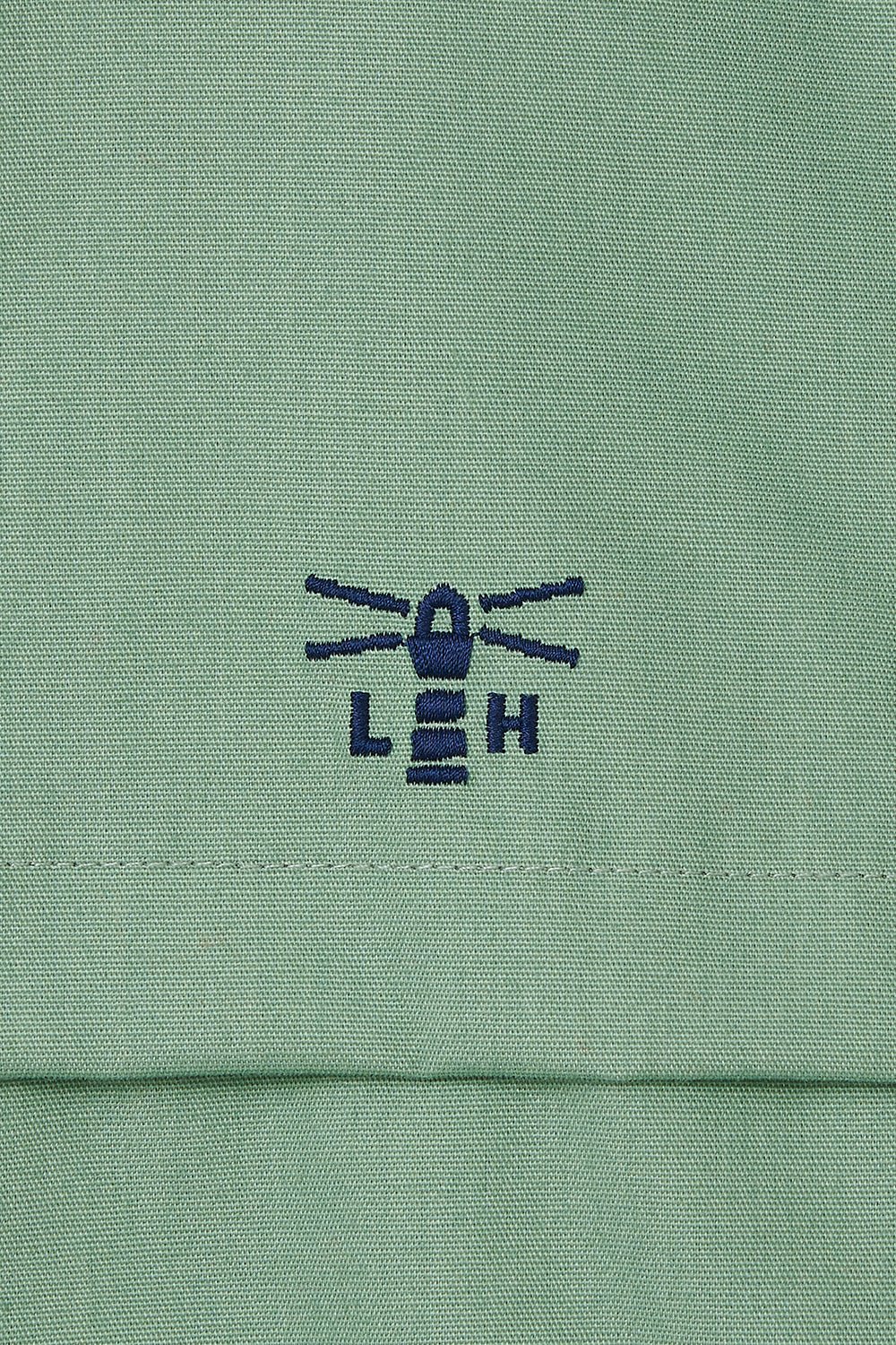 Waterproof Alicia women's jacket from Lighthouse in Pistachio Green with embroidered chest logo.