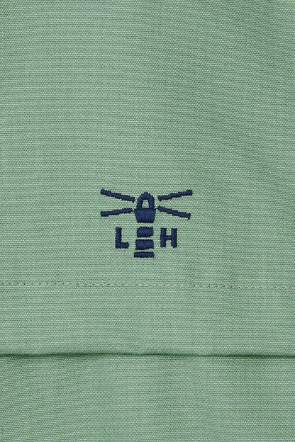 Waterproof Alicia women's jacket from Lighthouse in Pistachio Green with embroidered chest logo.