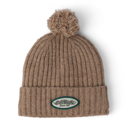 Front view of a Saltrock adults Legacy ribbed knit beanie with a turn back hem with logo patch and a bobble on top.