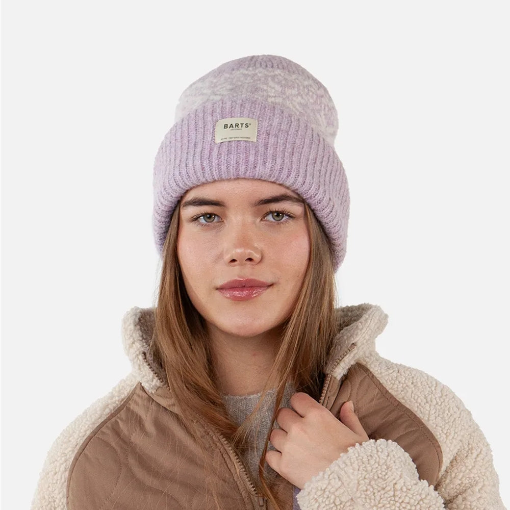Woman wearing a pink / lilac Barts knitted Negomba beanie with a turn-up hem on a white background