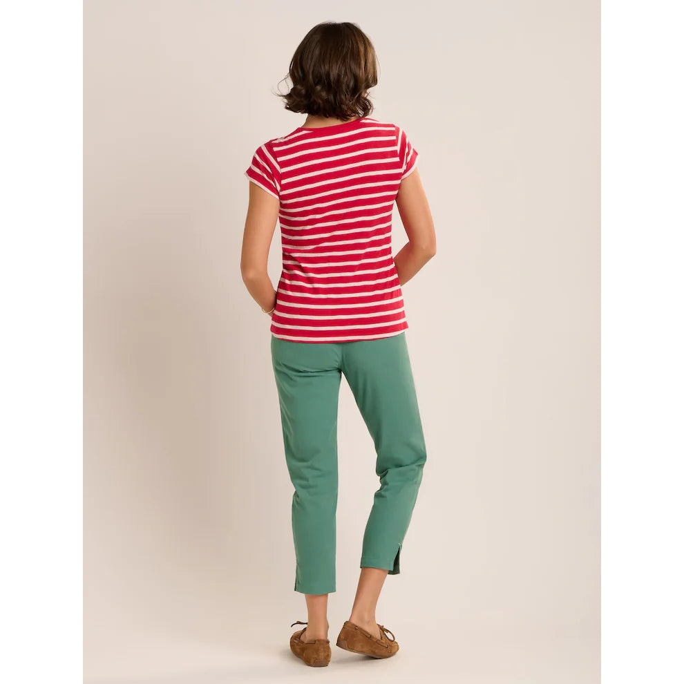 Back view of a woman wearing a Brakeburn red and white stripe Coastline short sleeve t-shirt with a pocket on the chest.