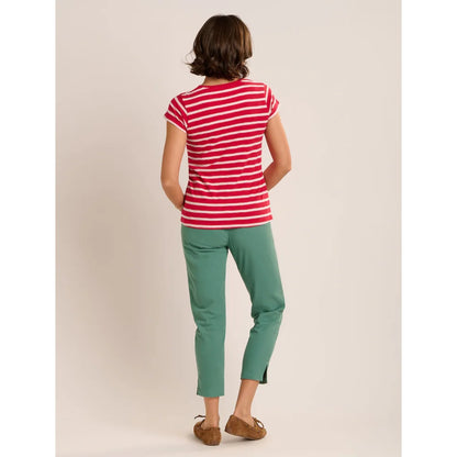 Back view of a woman wearing a Brakeburn red and white stripe Coastline short sleeve t-shirt with a pocket on the chest.