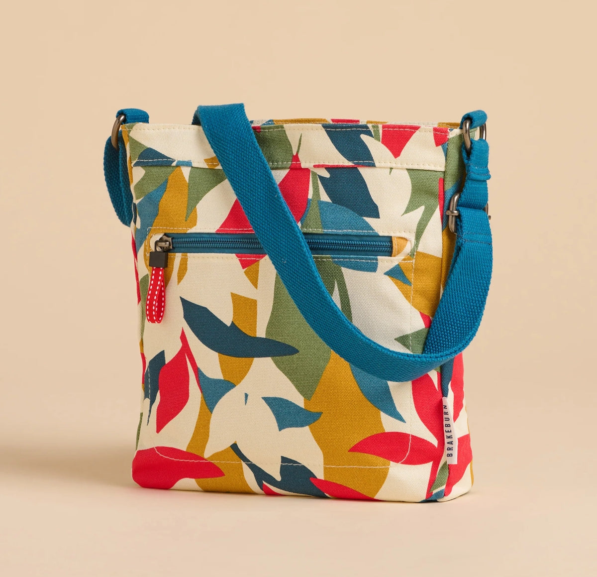 Brakeburn multicoloured cross body bag falling leaves pattern with blue adjustable strap
