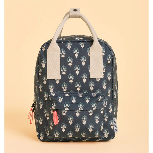 Front view of a Brakeburn Navy blue backpack with floral pattern on a beige background
