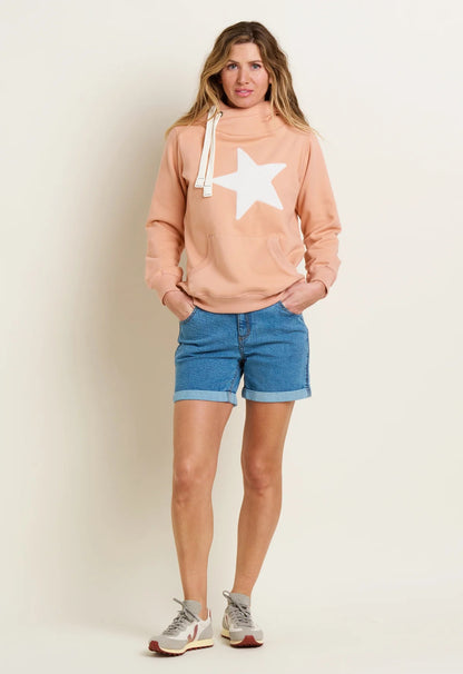 Brakeburn womens denim shorts in blue featuring rolled hems worn with a peach star sweatshirt