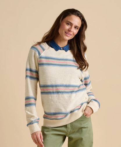 Brakeburn womens stripe jumper sweat in cream with blue and pink stripes worn by smiling woman