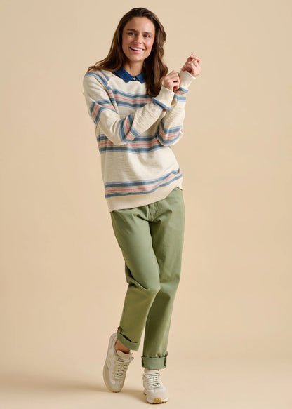 Brakeburn womens stripe jumper sweat with blue collar worn by smiling woman paired with green pants and white sneakers