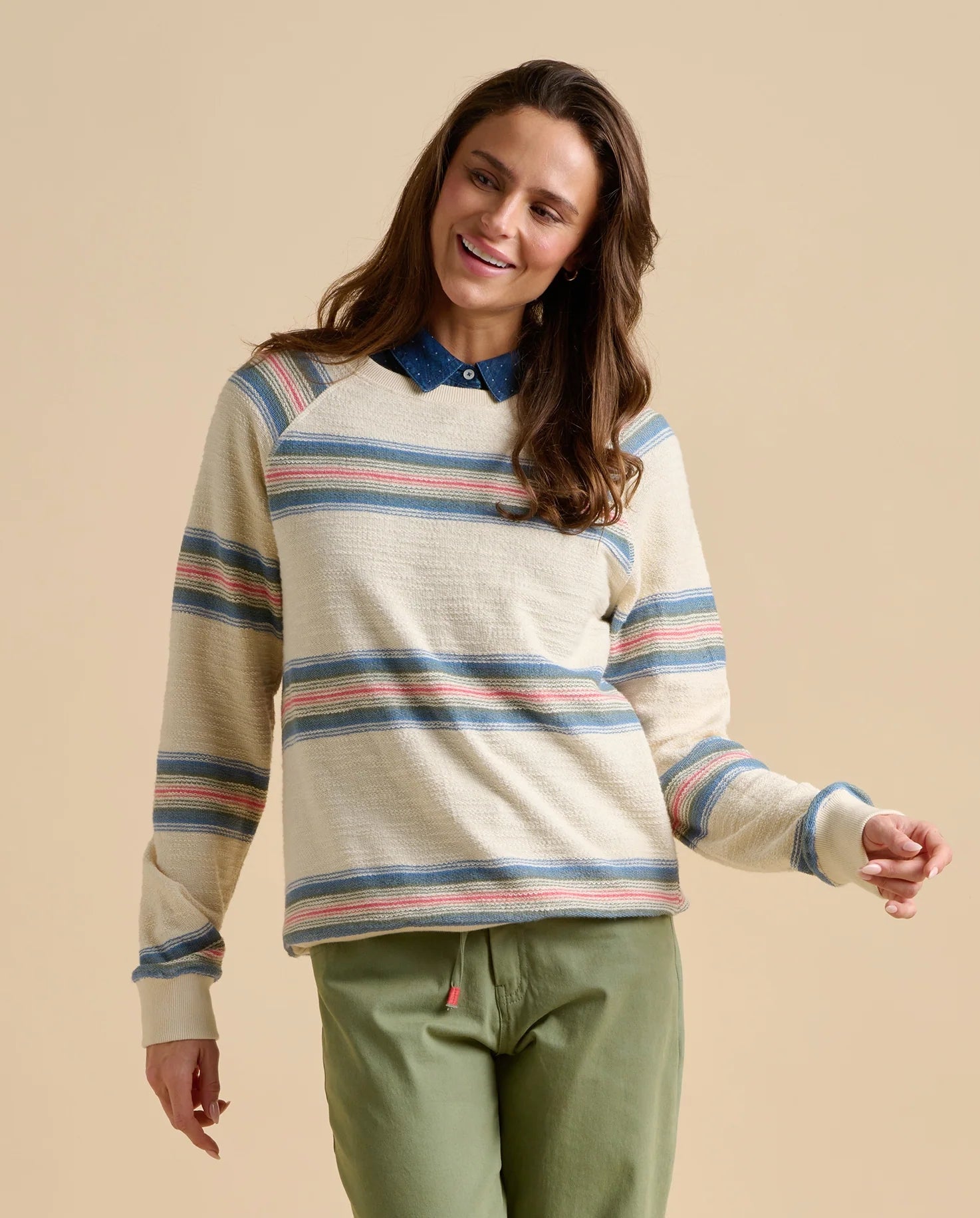 Brakeburn womens stripe jumper sweat with blue and pink stripes on cream background styled with green pants