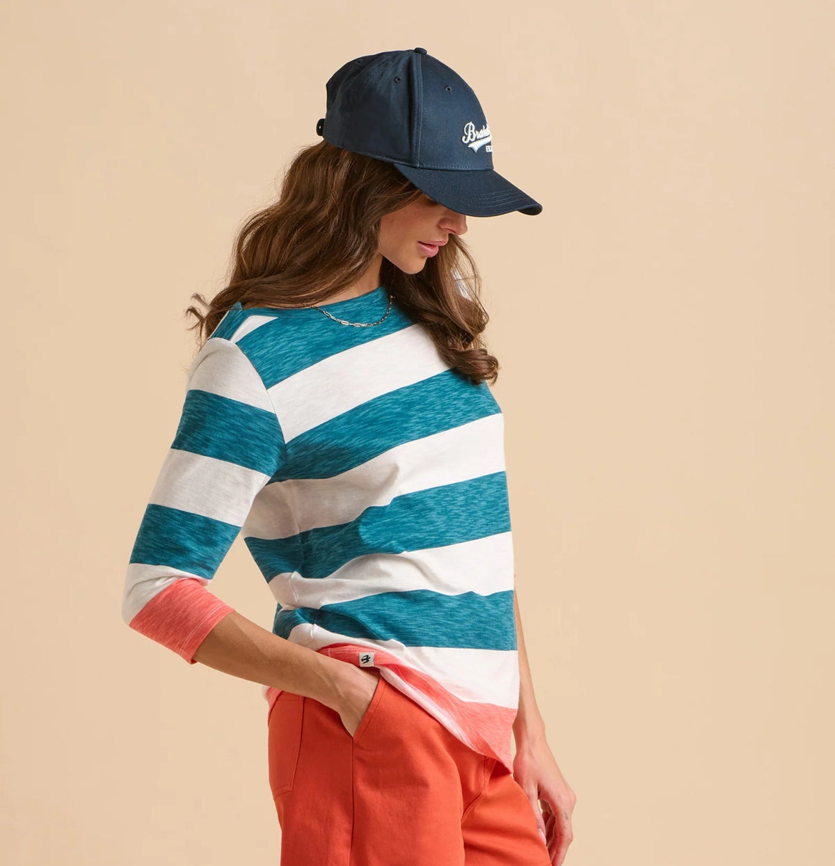 Brakeburn womens stripe t-shirt in blue and white horizontal stripes worn with coral pants and navy cap