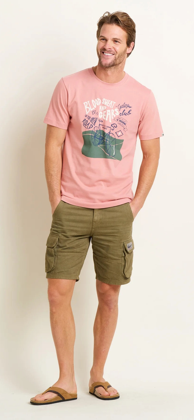 Short sleeve men's t-shirt from Brakeburn in pink with a cycling themed Blood, Sweat and Gears print on the front.
