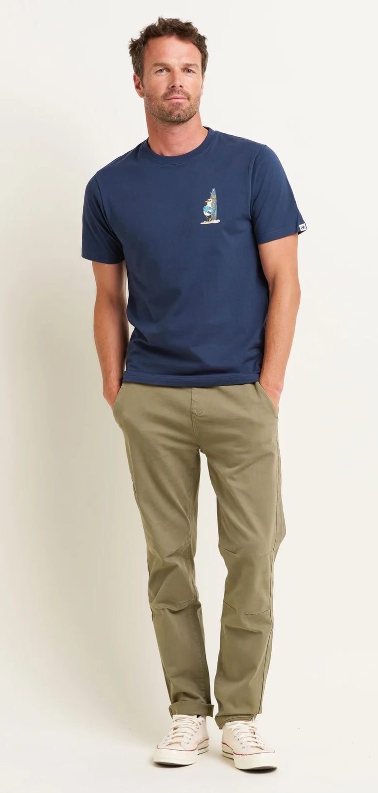 Seagull print men's t-shirt from Brakeburn featuring a large print of a seagull stood next to a surfboard on the back, with the front having a smaller version of the print.