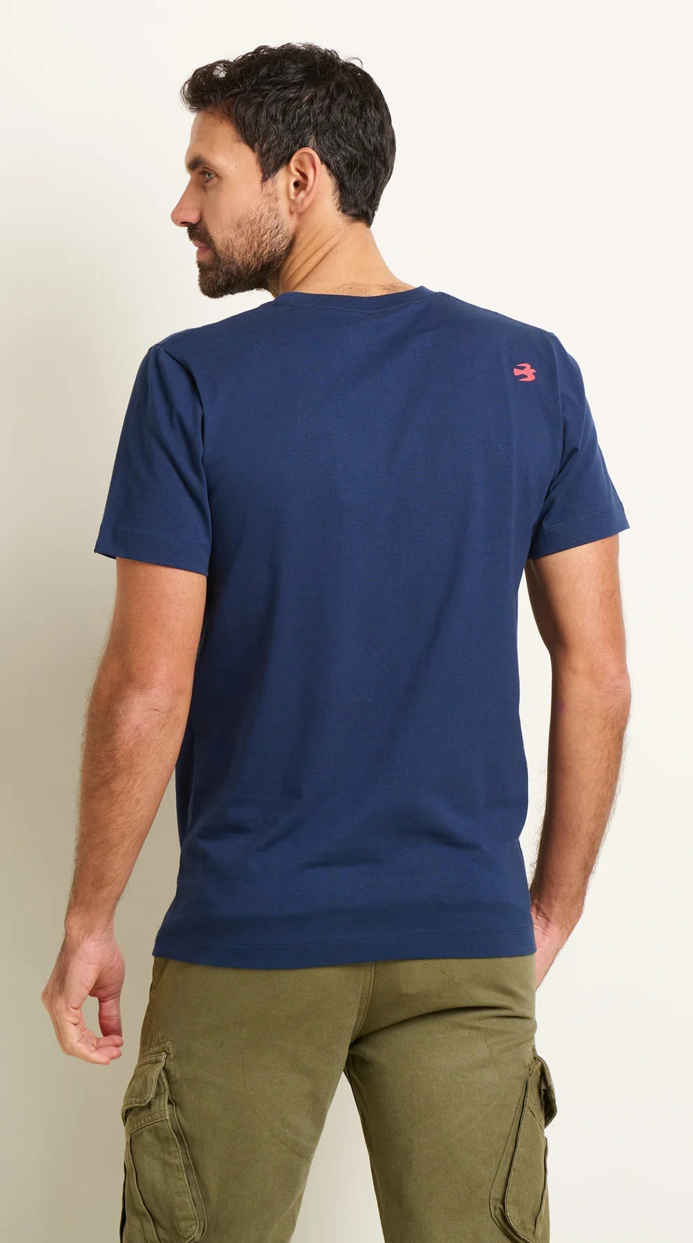 Navy men's Sitting Surfers tee from Brakeburn with waves and surfer print on the front.