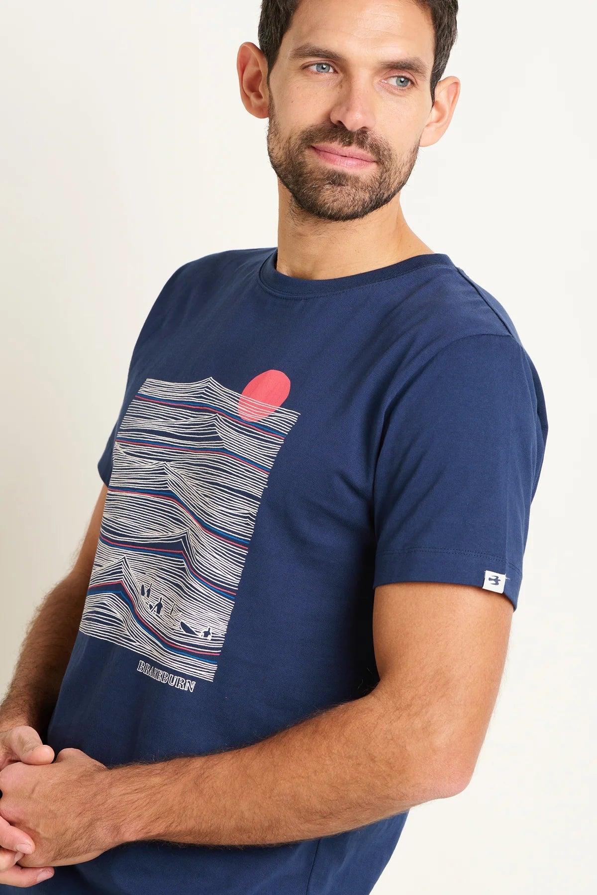 Brakeburn men's Sitting Surfer printed t-shirt featuring a linear style print of waves in navy.