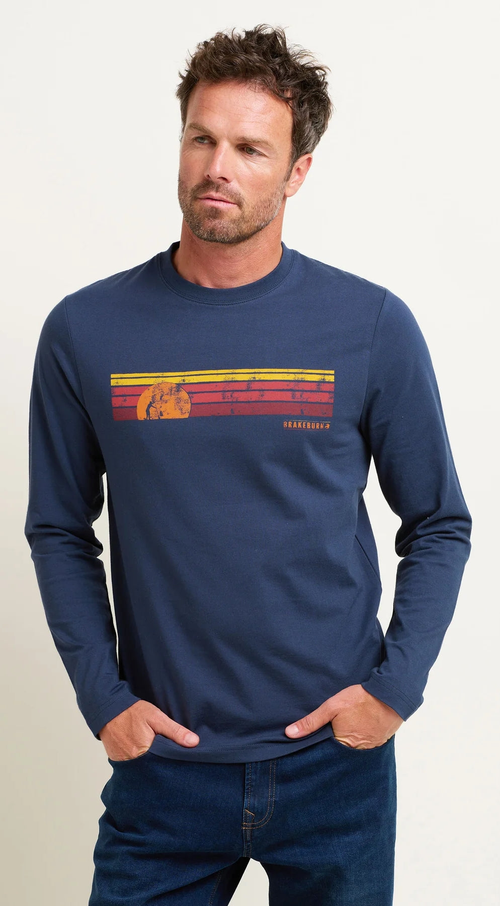 A men's long sleeve tee from Brakeburn in navy featuring distressed style sunset and stripes print across the chest.