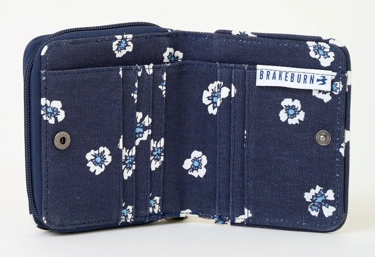 Brakeburn polka floral pattern purse in navy with coin compartment, note slip space and card slots. 
