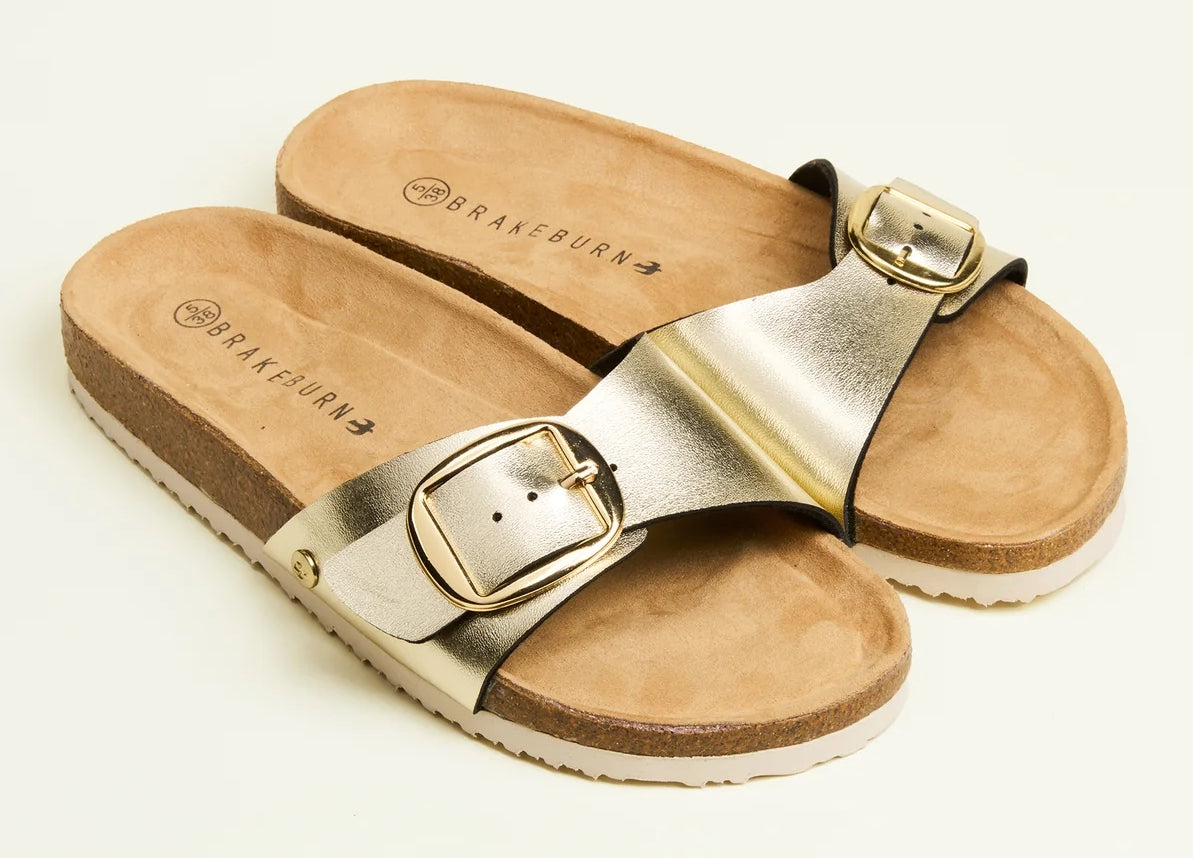 Brakeburn women's slip on style single strap sandals in metallic gold with buckle.