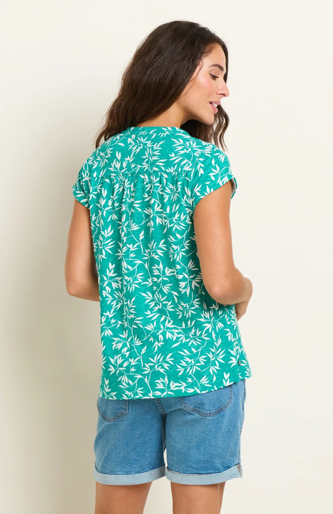 Short sleeve women's t-shirt from Brakeburn in green and white with notch neckline and bamboo leaf floral print.
