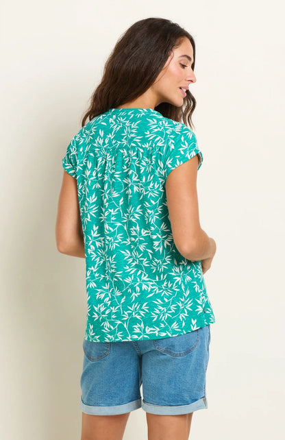 Short sleeve women's t-shirt from Brakeburn in green and white with notch neckline and bamboo leaf floral print.