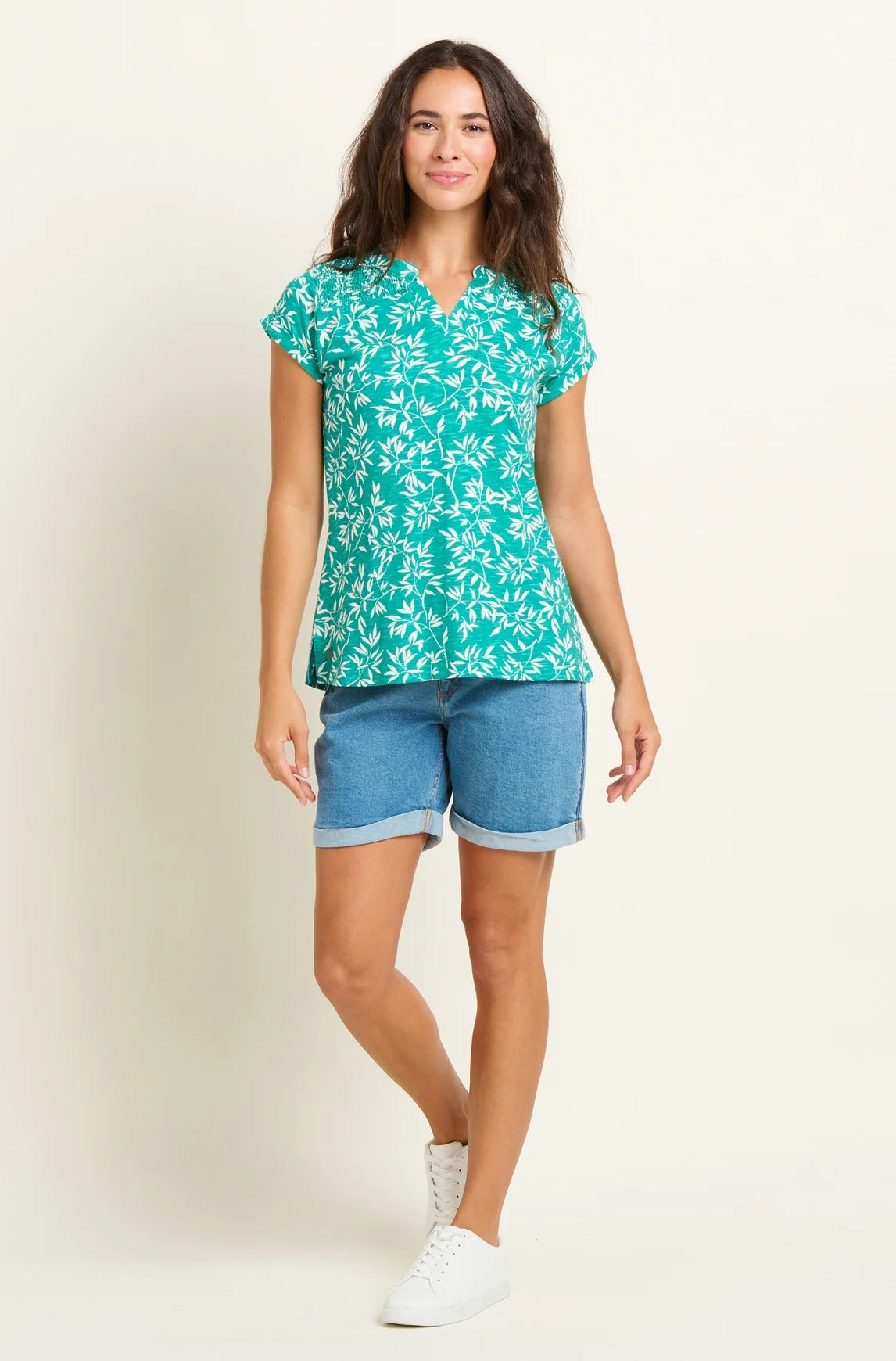Women's green and white short sleeve tee from Brakeburn with notch neckline and bamboo leaf pattern.