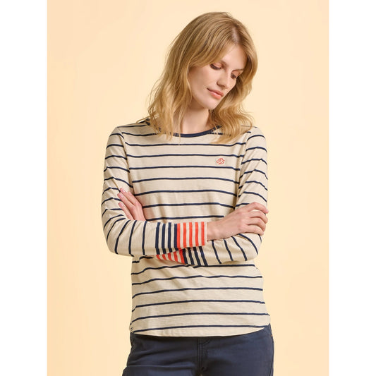Woman wearing a Brakeburn Knoll striped long-sleeve t-shirt in cream and navy on a beige background