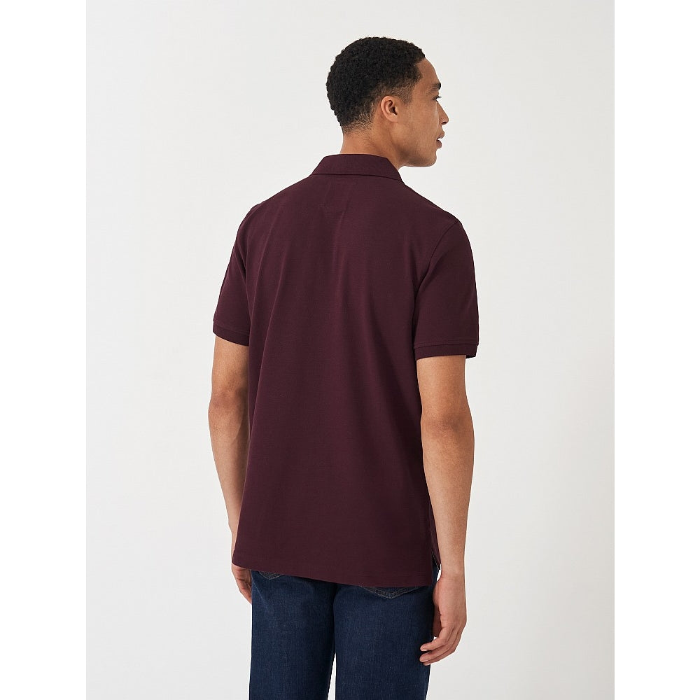 Back view of a mens Crew Clothing short sleeve classic pique polo shirt in Heritage Burgundy