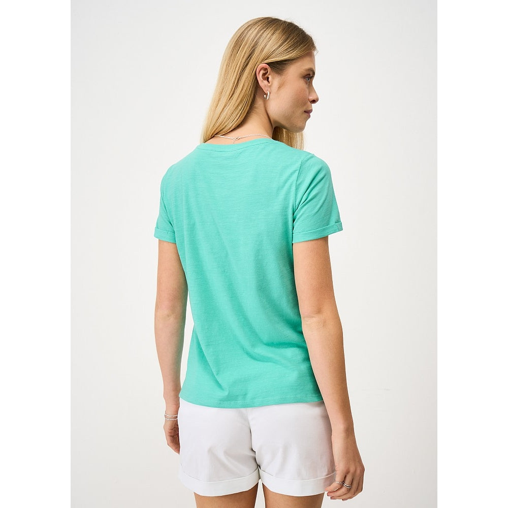 Back view of a woman wearing a Crew Clothing Perfect short sleeve plain t-shirt in Pool Blue turquoise with white shorts