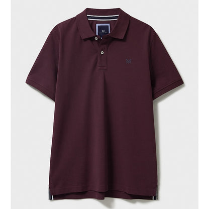 Front view of a mens Crew Clothing short sleeve classic pique polo shirt in Heritage Burgundy with small crossed oars logo on the chest