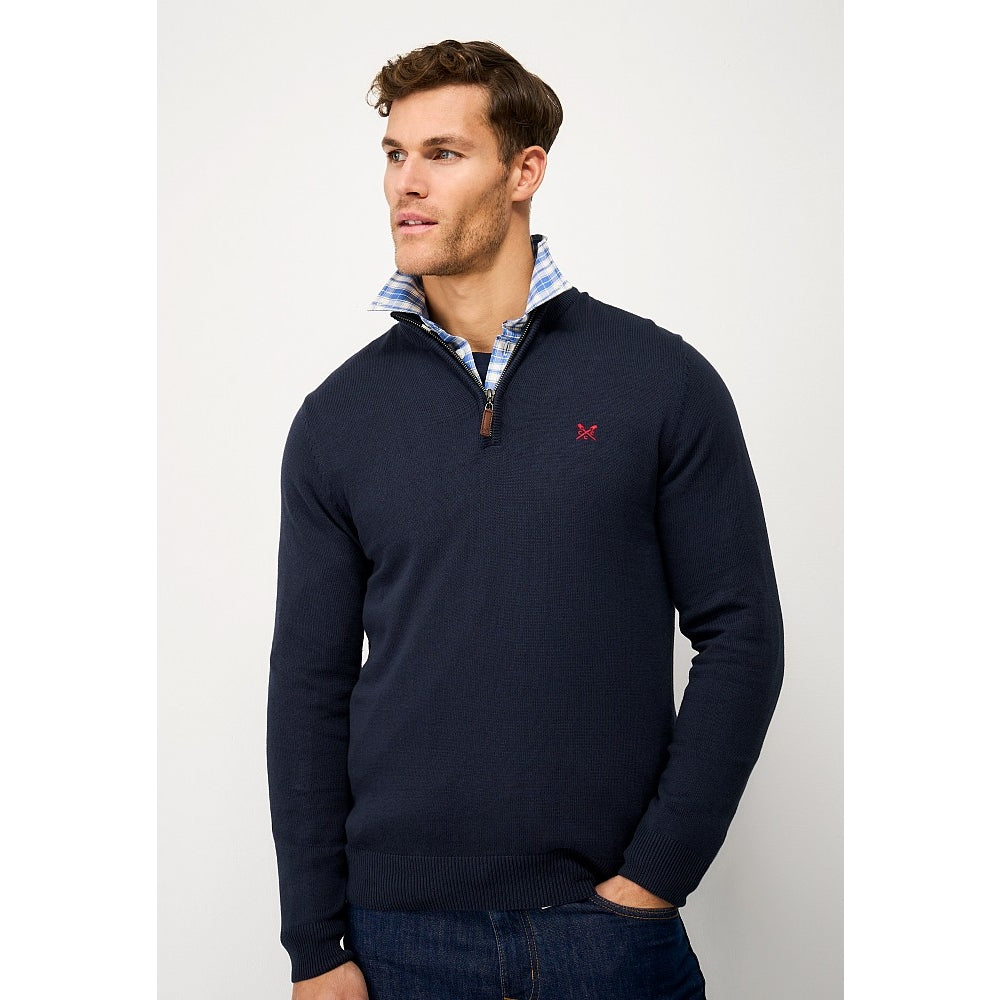 Front view of a man wearing a Crew Clothing 1/4 zip classic knitted jumper in Heritage Navy