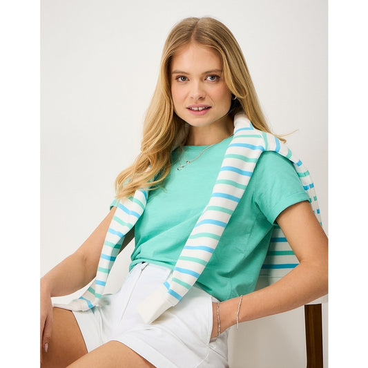 Woman wearing a Crew Clothing Perfect short sleeve plain t-shirt in pool blue turquoise with white shorts