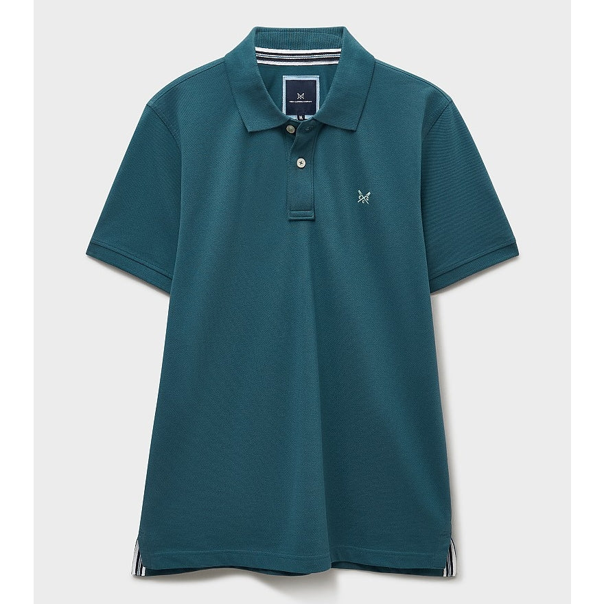 Front view of a mens Crew Clothing short sleeve classic pique polo shirt in Teal with small crossed oars logo on the chest