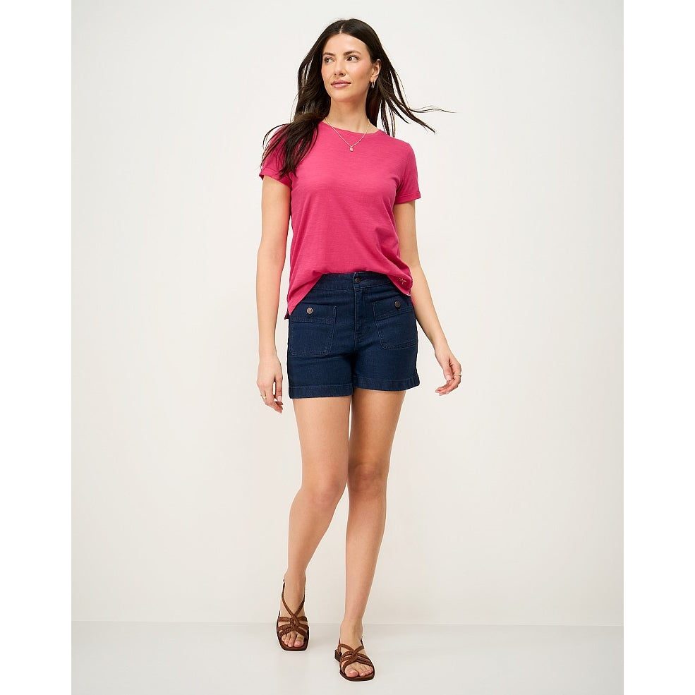 Woman wearing a Crew Clothing Perfect short sleeve plain t-shirt in raspberry pink with blue denim shorts and brown sandals