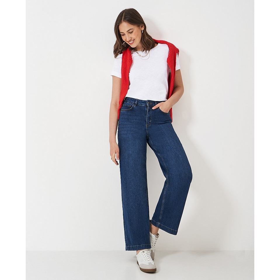 Woman wearing a Crew Clothing Perfect short sleeve plain t-shirt in white, with blue jeans, red jumper and trainers