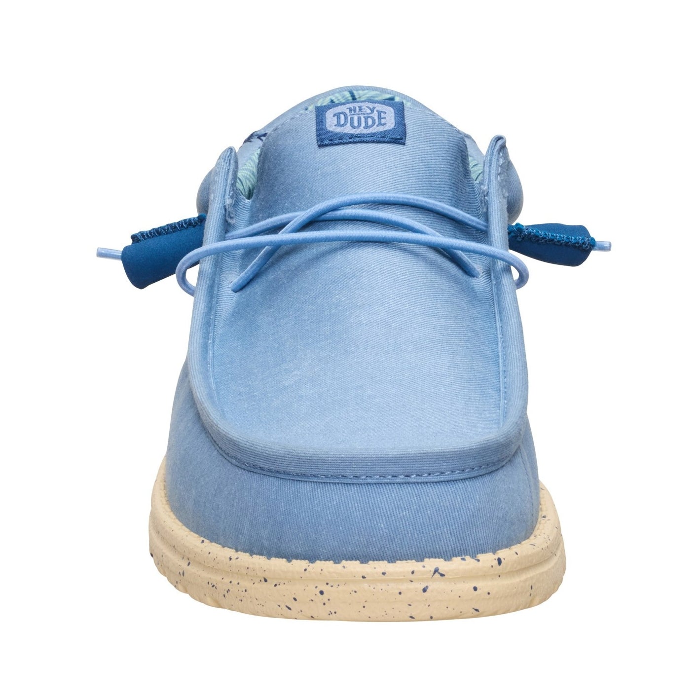 Front tow view of a men's Dude Wally Stretch Canvas lightweight shoe in Faded Denim Blue / Boulder Tan, with elastic laces and a speckled sole.