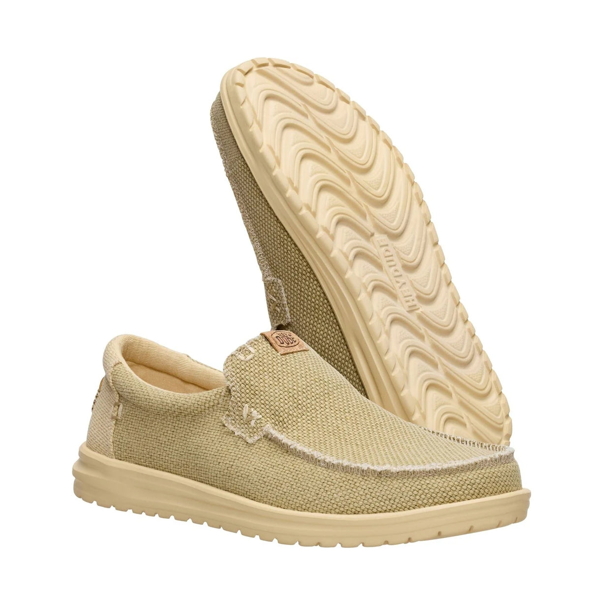 Men's Dude Mikka Braided lightweight slip on canvas shoes in Olive Grey / Boulder Tan, showing the EVA beige outsole of one shoe.