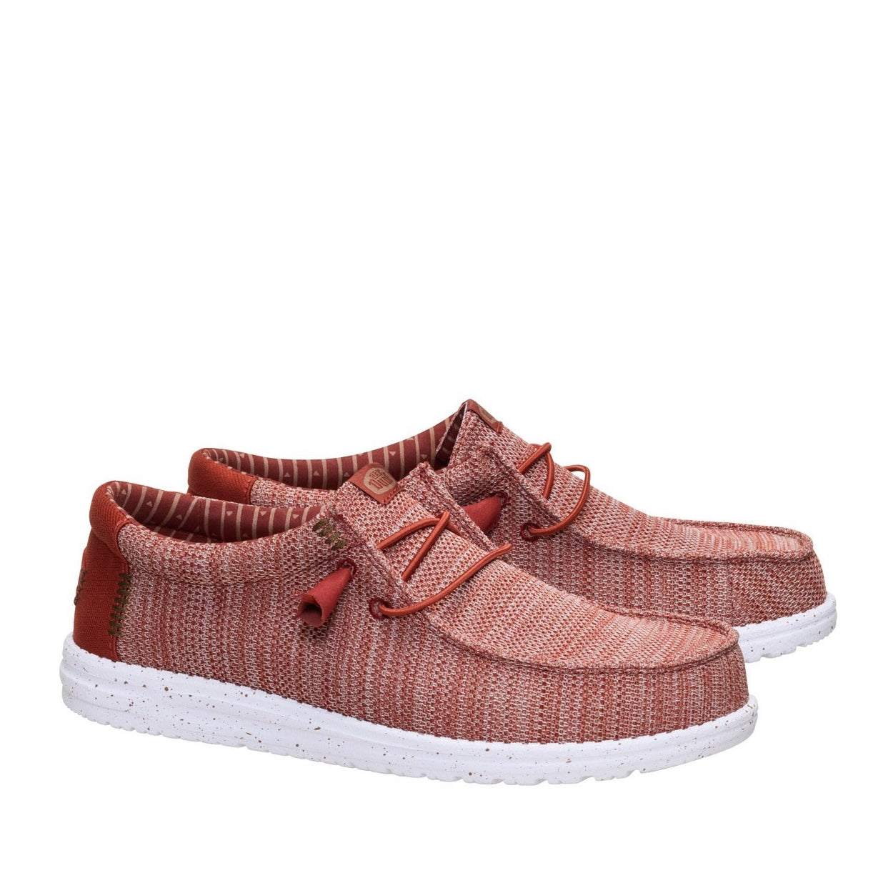 A pair of men's Dude Wally Stretch Sox shoes in Burnt Red / Multi with white speckled soles, elastic laces and brown stitching accents.