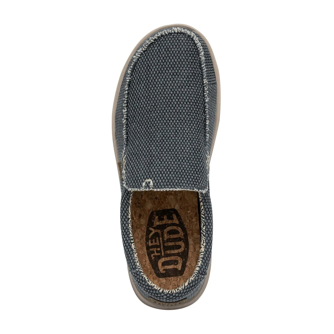 Top view of a men's Dude Mikka Braided lightweight slip on canvas shoe in Deep Blue with cork effect footbed and Hey Dude logo.