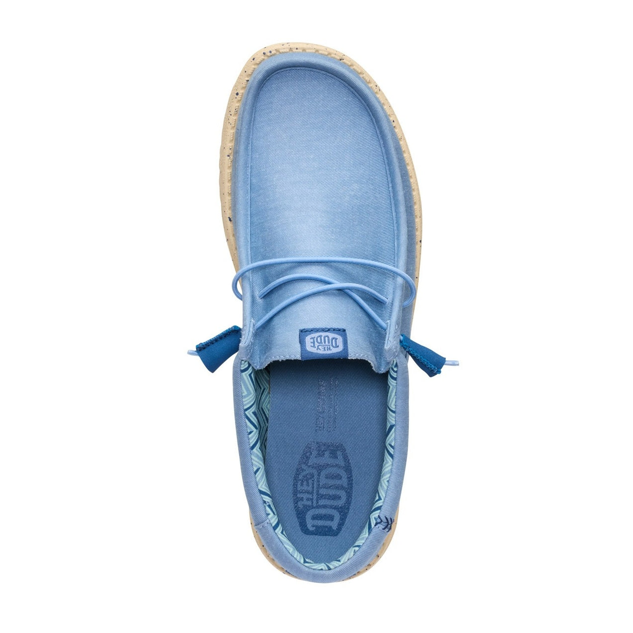Top view of a men's Dude Wally Stretch Canvas lightweight shoe in Faded Denim Blue / Boulder Tan, with elastic laces and a Hey Dude logo printed on the removable footbed.