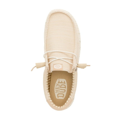 Top view of a men's Dude Wally Stretch Sox lightweight mesh shoe in Irish Cream / Egret, with elastic laces and a removable insole with Hey Dude logo.