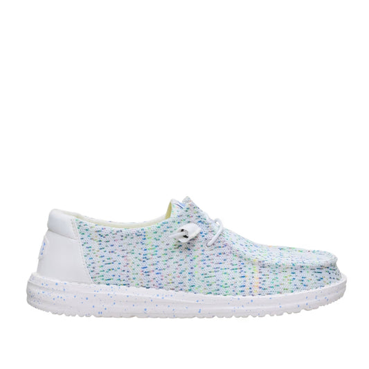 Side view of a women's Dude Wendy Stretch Speckle shoe, featuring a white base with a multicolour speckle pattern of blue, green, and pink, with a solid white sole, heel and white laces.
