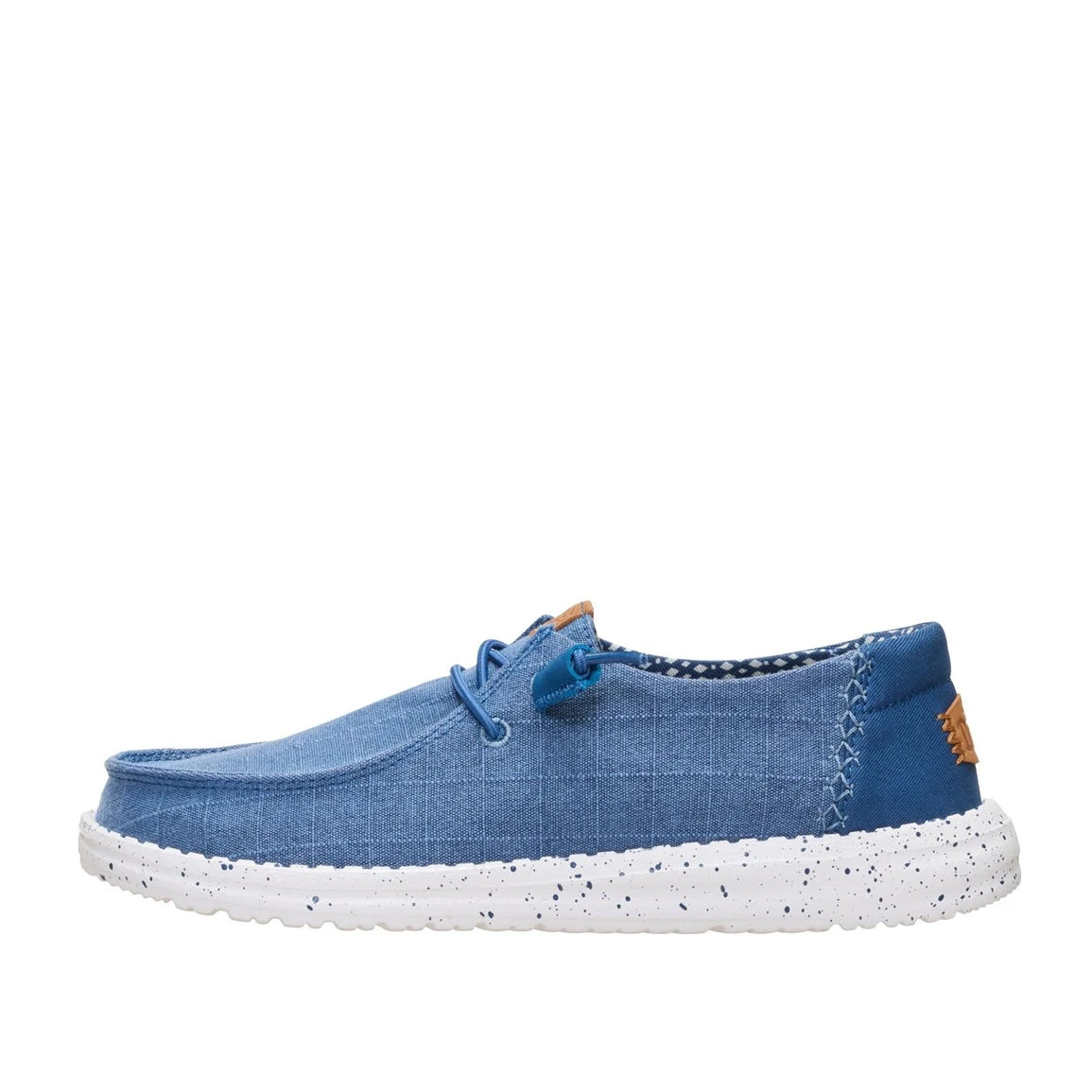 Side view of a women's Dude Wendy Chambray Grid shoe in Ensign Blue, featuring,= matching blue elastic laces and speckled white sole.