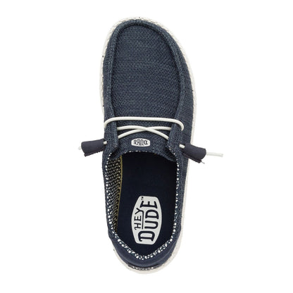 Top view of a women's Dude Wendy Stretch Sox shoe in Navy, featuring white elastic laces and removable insole with Hey Dude logo on the footbed.