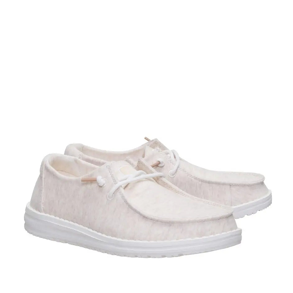 A pair of a women's Dude Wendy Stretch Jersey lightweight Summer shoes in Oatmeal, featuring a heathered upper fabric, white sole and elastic laces.