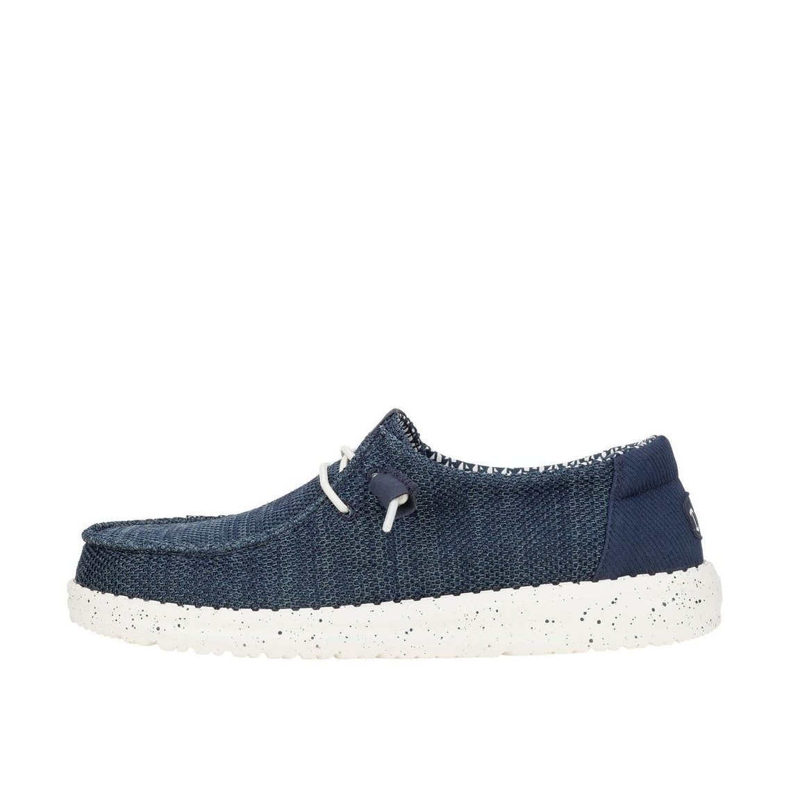 A womens Dude Wendy Stretch Sox slip-on knit shoe in navy blue with a white speckled sole and white laces, shown from a side profile.