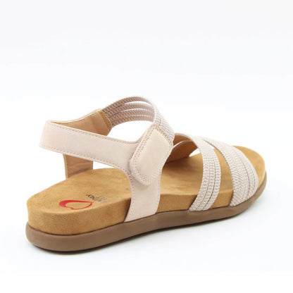 Back view of a women's Heavenly Feet Tyra sandal in beige with two front straps, adjustable ankle strap and a tan coloured sole.