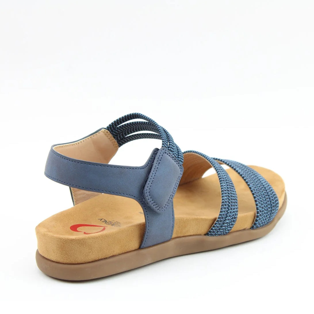 Back view of a women's Heavenly Feet Tyra sandal in navy blue with two front straps, adjustable ankle strap and a tan coloured sole.