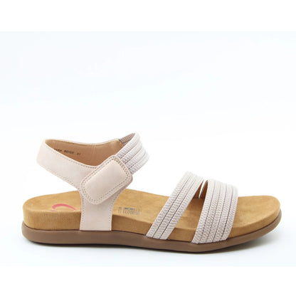 Side view of a women's Heavenly Feet Tyra sandal in beige with two front straps, adjustable ankle strap and a tan coloured sole.