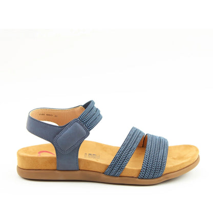 Side view of a women's Heavenly Feet Tyra sandal in navy blue with two front straps, adjustable ankle strap and a tan coloured sole.